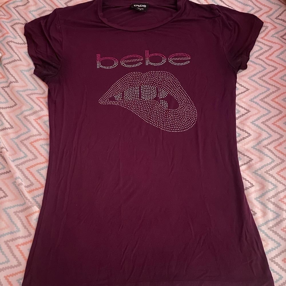 Burgundy Bebe shirt with rhinestone design on the front